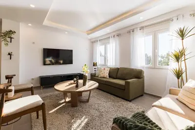 a living room with a couch and a table at Villamadero Tu refugio de tranquilidad y confort in Torrent