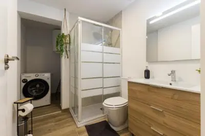 a bathroom with a toilet and a sink and a mirror at Monte Taxco Escapada perfecta en un entorno único in Torrent
