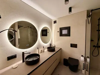 a bathroom with two sinks and a mirror at Sunny Waves Apartment in Cullera