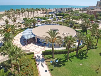 an aerial view of a park with palm trees at Patacona Azud in Valencia