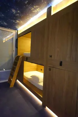 a room with a bunk bed and a window at Joaquin Sorolla Pod Hostel in Valencia