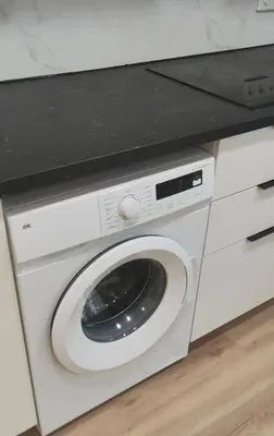 a washing machine with a black counter on top of it at Studio with garden views in Valencia