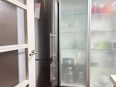 a stainless steel refrigerator next to a window at Centro Histórico Valencia 2 Hab in Valencia