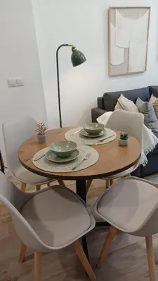 a living room with a couch and a table at ConchaBeach Valencia in Valencia