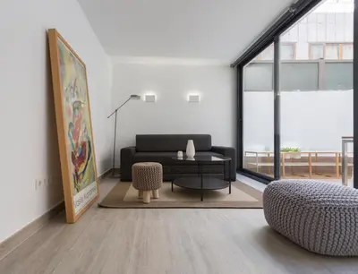 a living room with a couch and a table at Austria 4 in Valencia