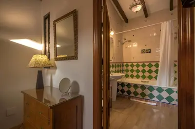 a bedroom with a bed and two lamps on tables at Beds & Breaks Verdi in Valencia