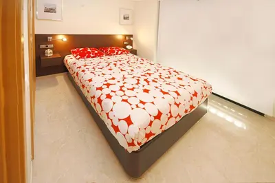 a living room with a couch and a glass table at Beds & Breaks Soler in Valencia