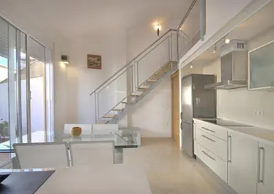 a white bedroom with a bed and a balcony at Beds & Breaks Pergolesi in Valencia