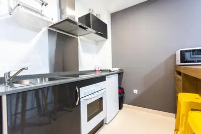 a kitchen with a sink and a stove at Total Valencia Old City Luxury in Valencia