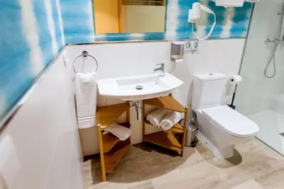 a bathroom with a sink and a toilet at Host & Home in Valencia