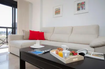 a living room with a couch and a coffee table at SingularStays Artes in Valencia