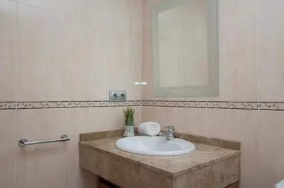 a bathroom with a sink and a mirror at SingularStays Artes in Valencia
