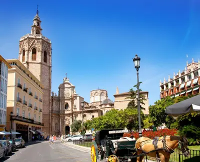 a horse drawn carriage in front of a building at SingularStays Artes in Valencia