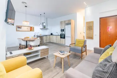 a living room with a couch and a table at Travel Habitat Ayuntamiento in Valencia