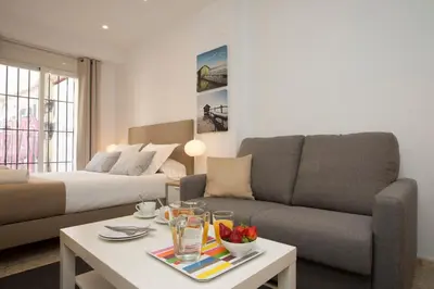 a living room with a couch and a coffee table at Poeta Llombart Apartment in Valencia