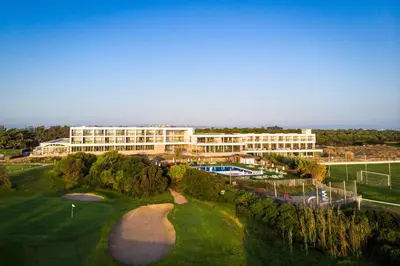 an aerial view of a building and a golf course at Parador de El Saler in El Saler