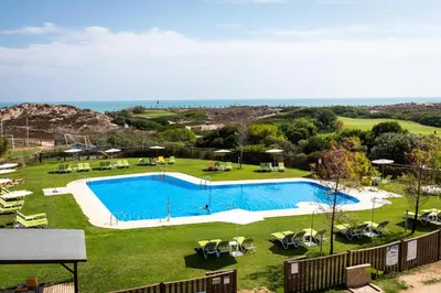 an image of a swimming pool in a yard at Parador de El Saler in El Saler