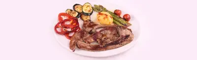 a plate of food with meat and vegetables on it at La Posá in Villar del Arzobispo