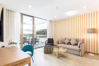 a living room with a couch and a table at Hotel Barú in Sagunto