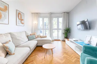 a living room with a couch and a table at Travel Habitat Torres de Serrano in Valencia