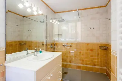 a bathroom with a sink and a shower at Apartamento Torres in Valencia