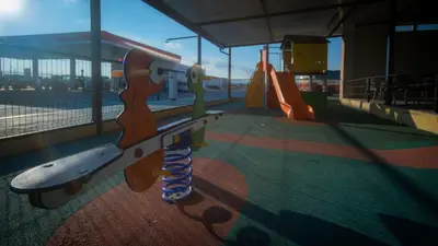 a playground with a slide in a building at Hotel Puerta de la Serrania in Lliria
