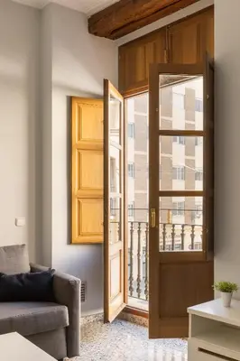 a living room with a door and a window at Macflats Valencia Puerto in Valencia