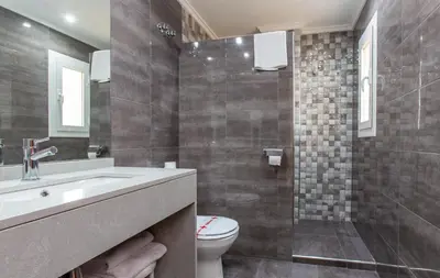 a bathroom with a sink and a toilet at Hotel Olympia Ronda I in El Puig