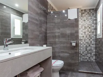 a bathroom with a sink and a toilet at Hotel Olympia Ronda I in El Puig
