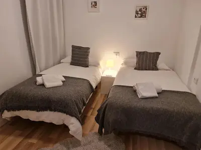 two beds in a small room with at Alojamientos Segóbriga Rural (Artesa) in Segorbe