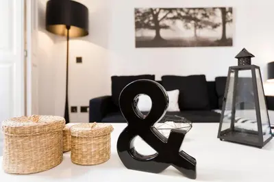 a black item on a table in a living room at Total Valencia Cathedral in Valencia