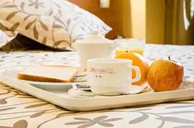 a tray with a breakfast of bread and coffee and fruit at Torrijos in Cheste