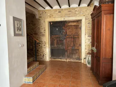 a room with a large wooden door in a building at Apartamentos turísticos 