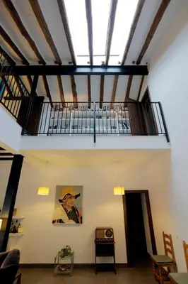 a room with a ceiling with a bar in it at El Campillo, casa de campo cerca de la playa in Navajas