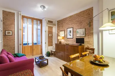 a living room with a purple couch and a table at My Loft 4 You Borgia in Valencia