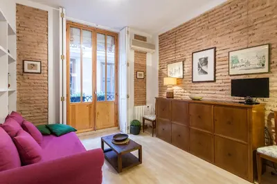 a living room with a purple couch and a tv at My Loft 4 You Borgia in Valencia