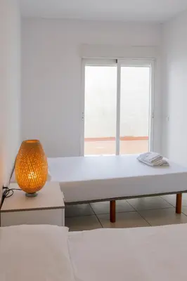 a white room with a bed and a window at Quart Silence in Valencia