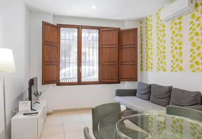 a living room with a couch and a glass table at Quart Silence in Valencia
