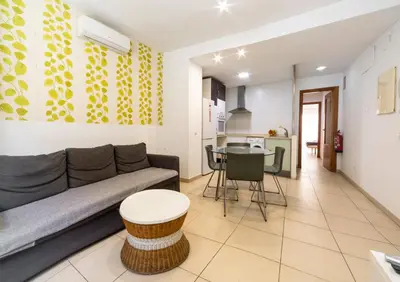 a living room with a couch and a table at Quart Silence in Valencia