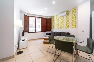a living room with a table and a couch at Quart Silence in Valencia