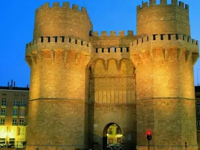 a large castle with two towers in front of a building at Apartamento Ciudad de las Ciencias in Valencia