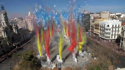 a crowd of people on a city street with a fountain at Apartamento Cardenal in Valencia