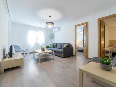 a living room with a couch and a table at Piso Carolina in Valencia