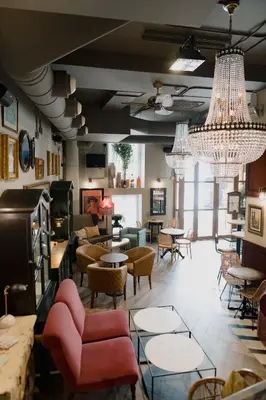 a large room with chairs and tables and chandeliers at MYR Marqués House in Valencia