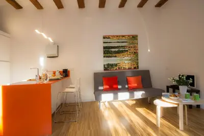 a living room with a couch and a table at Balcón de Manet in Valencia