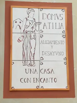 a drawing of a woman on a sign on a wall at B&B 
