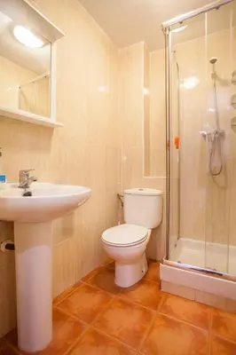 a bathroom with a toilet and a sink and a shower at Apartamento Alta in Valencia