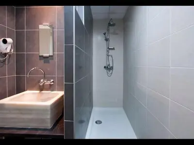 a bathroom with a sink and a shower at Calatrava in Valencia