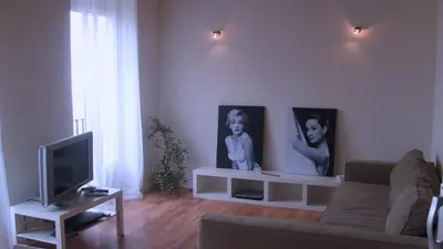a living room with a couch and a tv at Calatrava in Valencia