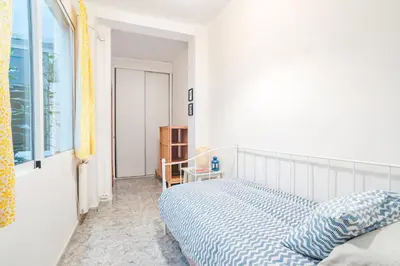 a bedroom with a bed and a window at Cisneros flat in Valencia